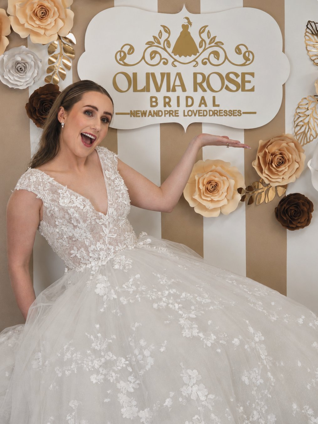Bride in a lace ball gown wedding dress at Olivia Rose Bridal boutique, Kāpiti Coast